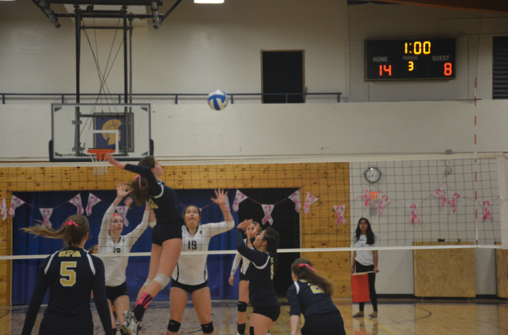 Freshman Blythe Rients returns the ball against opponent Providence. The Varsity Volleyball team fought hard, but lost to Providence 3 sets to 2