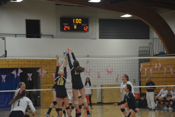 Sophomore Ashley Jallen and freshman Blythe Rients team up for a block