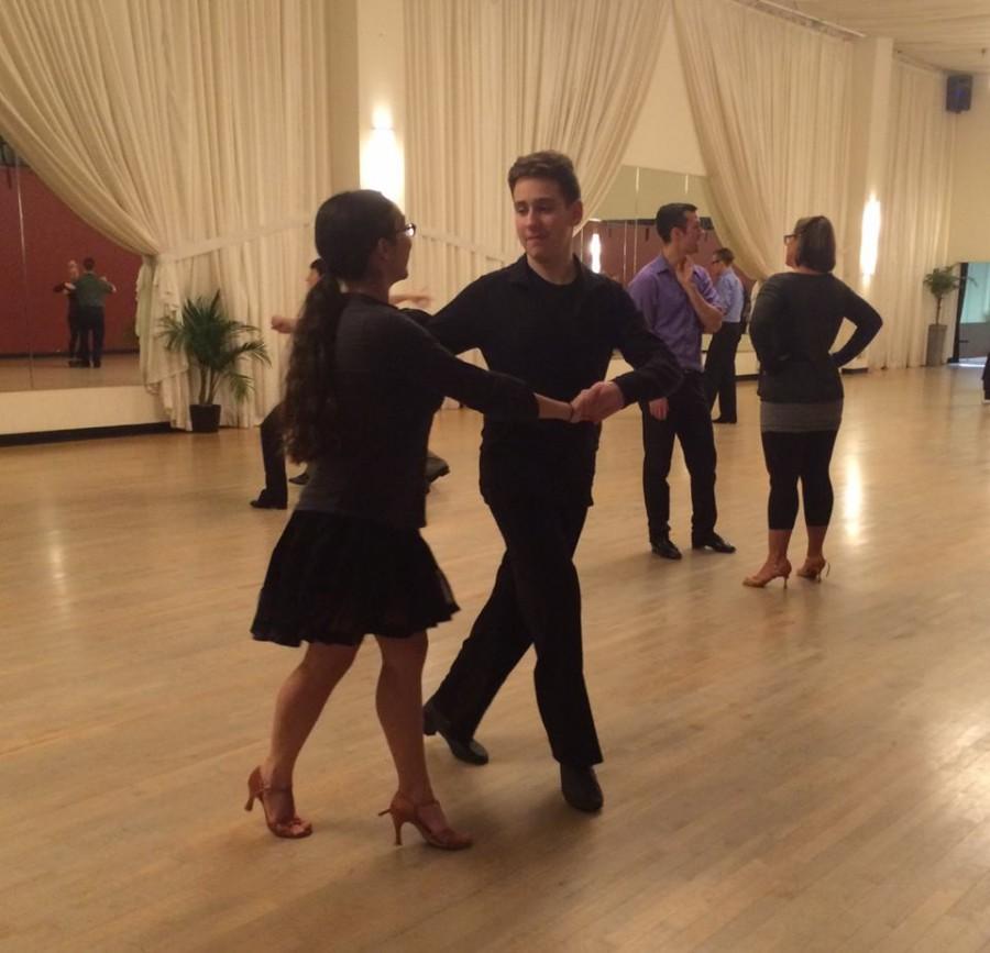 Freshman Reuben Vizelman dances at Cinema Ballroom with his partner. "“Working with Maddie [my dance partner] is a lot of fun. It is important that we have a good relationship because we have to work and compete together. In dance, trust and chemistry between the partners is almost as important as the dance itself,” Vizelman said.