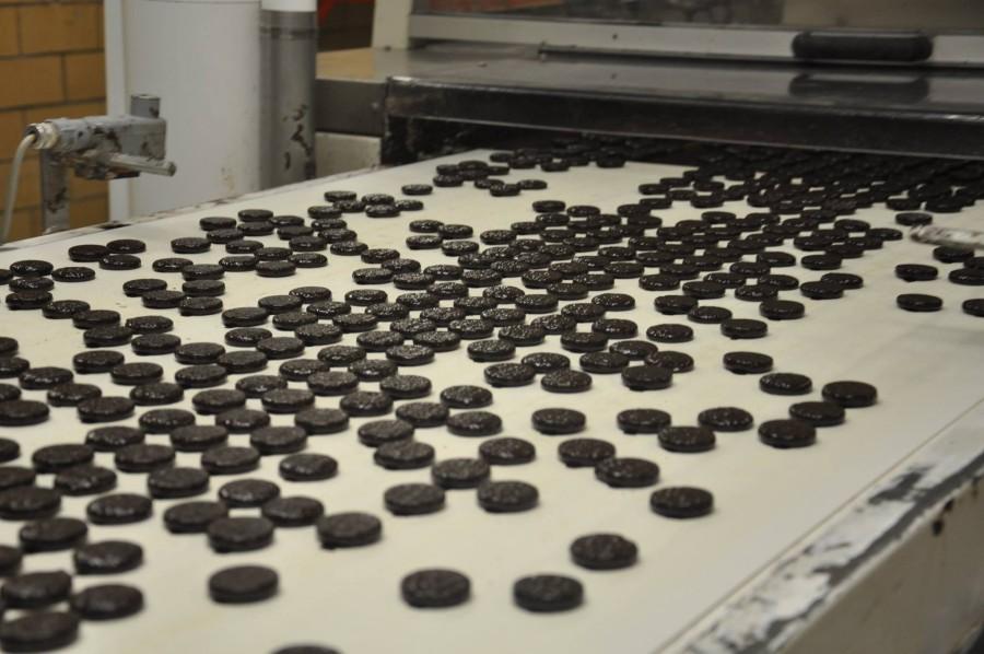 When the Mint Patties have finished cooling overnight, they are slid onto a conveyer belt that will soon dunk them in extremely hot liquid dark chocolate. They are then carried out of the liquid and placed back on the conveyor belt where they go through a very long cooling tunnel until the chocolate hardens. “There is really no downside to being in the business of making candy. Candy seems to make almost everybody smile; and it’s good to be associated with a business that makes people feel that way,” Keller said.