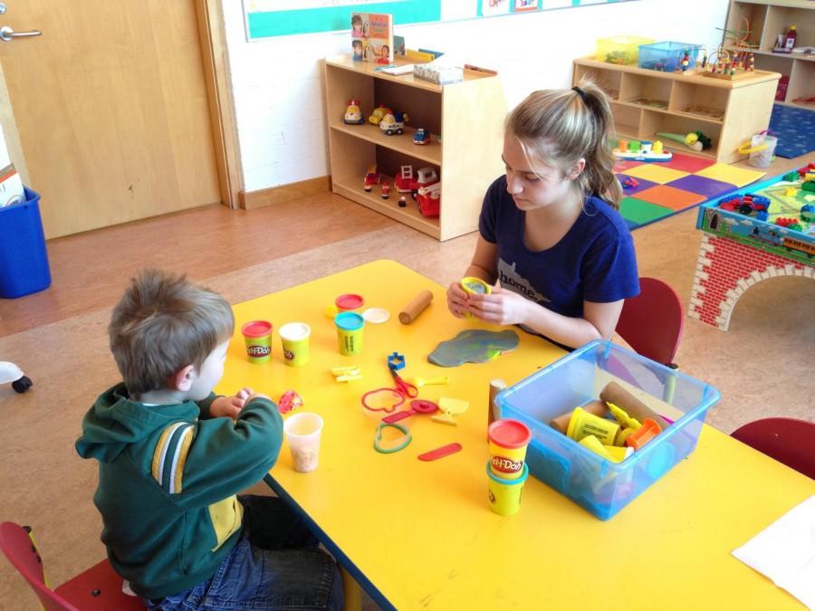 Gabby Harmoning works as a madrichim in the Childcare Room at her temple on Sundays.  “[My favorite part about my job is] getting to bond with the kids… I think it’s fun,” Harmoning said.