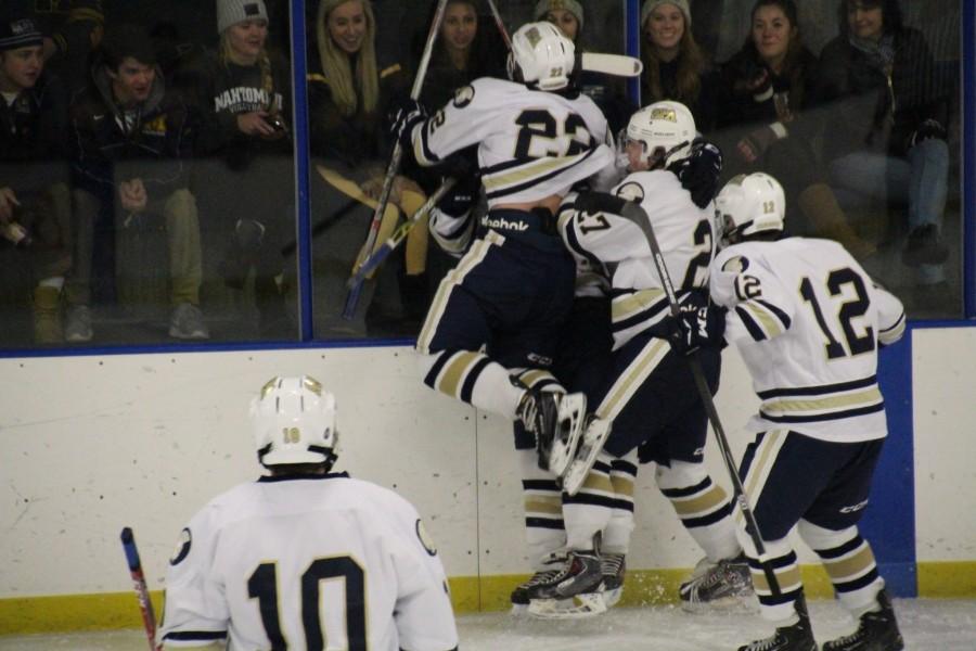 The Spartans celebrate Will Kellys first period goal scored with less than second left in the period.