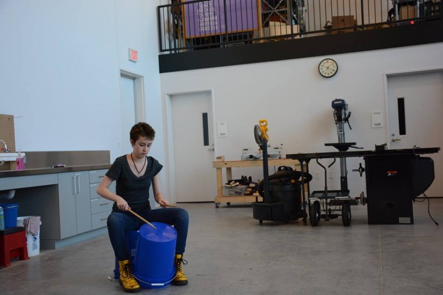 Senior Alice Tibbetts taps out a rhythm on an overturned plastic bucket. “We don’t play pop or rock, but really weird world music that has a lot of complicated sounding rhythms. A bunch of people play different simple rhythms that twine together and sound cool,” Tibbetts said.