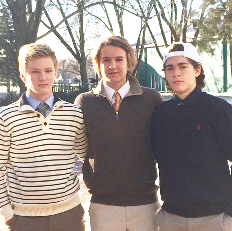 Boys Varsity Hockey players sophomore Dev McCabe and juniors Matt Dahlseide and Jack Johnston pose before a home game in their 'fancy clothes'