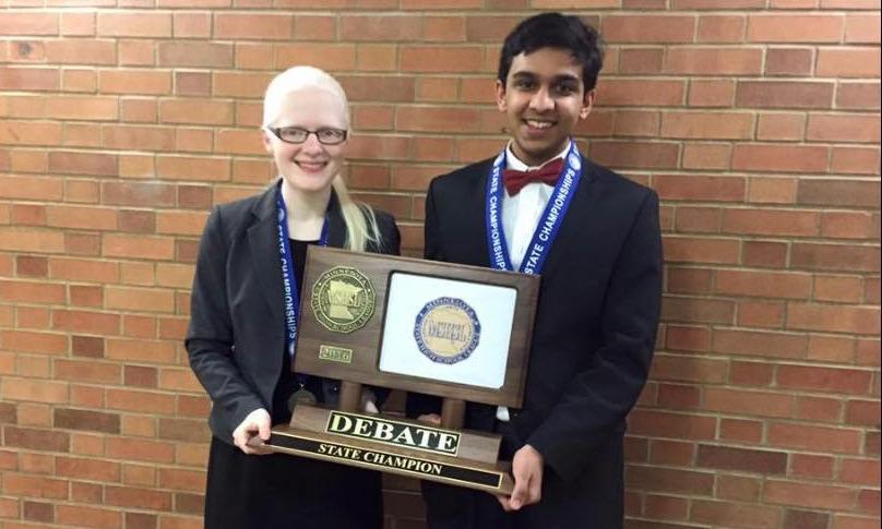 Junior Sarah Wheaton and sophomore Adnan Askari smile after winning first place in the Public Forum State Tournament on Jan. 19.