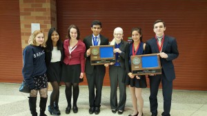 Debate team competitors pose for a photo after awards.  Pictured are seniors Liza Bukingolts, Navodhya Samarakoon and Maya Smith, sophomore Adnan Askari, and juniors Sarah Wheaton, Shefali Bijwadia and Raffi Toghramadjian.