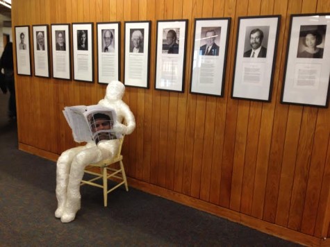 This tape sculpture, located in the second floor hallway, reads the December issue of The Rubicon.