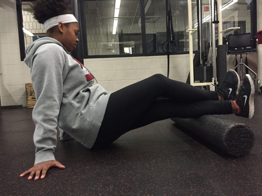 Sophomore Olivia Williams-Ridge rolls out her calves. “It’s hard with hockey and softball because I come off the hockey season feeling so tired and dead, but softball season starts so soon, Williams-Ridge said.