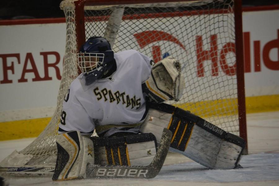 Sophomore Andy Beran protects his post in the third period. Beran faced only two shots in the third period.