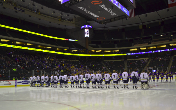 The team lines up before the game after they are announced. None of us have been here before, but despite that, we handled it perfectly, senior Justin Jallen said. 