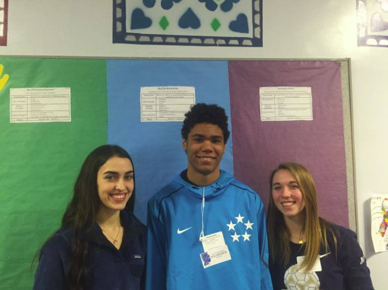 Juniors Genevieve Zanaska, David Santos, and Justine Miller volunteered at the Community School of Excellence on Service Day. "It was fun working with the kids. The kindergartners were my favorite," Santos said.