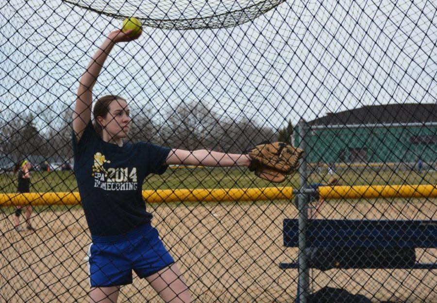 Eighth+grader+Kathleen+Bishop+warms+her+pitching+arm+before+a+game.
