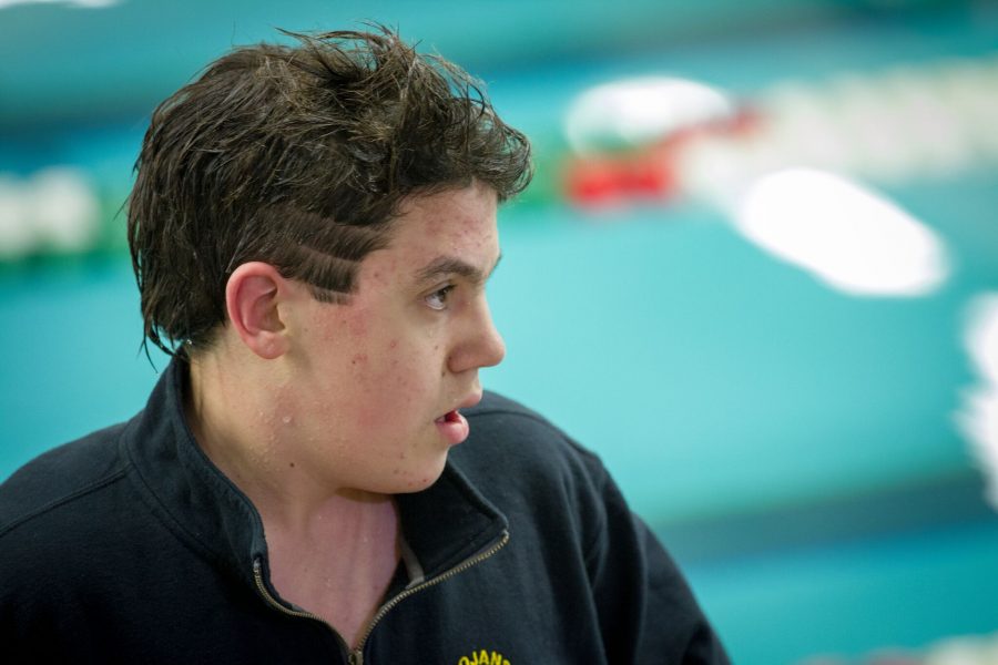 Sophomore Breandan Gibbons stands on the podium at his sections swim meet.  Its a sport that I love and a community that has done a lot for me personally and I want to give those same opportunities and experiences to other athletes trying to get involved in swimming, Gibbons said.