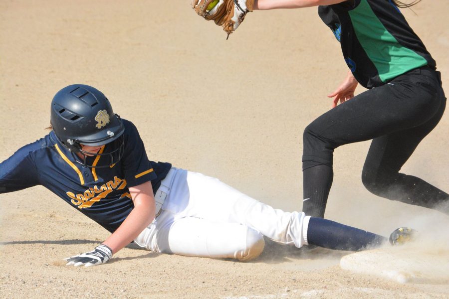 Junior Justine Miller slides into third base.