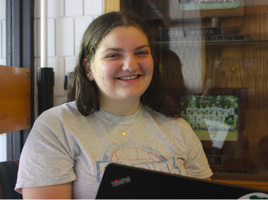 Freshman Annie Bottern moves from the library down to the couches in the Huss Center next to Trophy Cases. "I don't like doing work at home so I do it at school because sometimes I don't want to do work but I have to," Bottern said. 