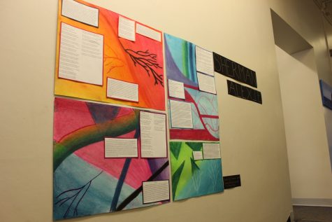 Senior Alena Porter's poster about Sherman Alexie's poetry adds a pop of color to the English wing. 