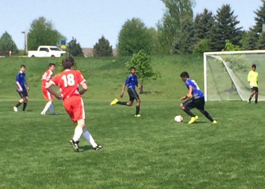 FRESHMAN JASPER GREEN plays offense at one of his club games. “We’ll stay with Swedish or Danish soccer families and in a High School during our time in Sweden, and I’m excited to experience the new country,” Green said.