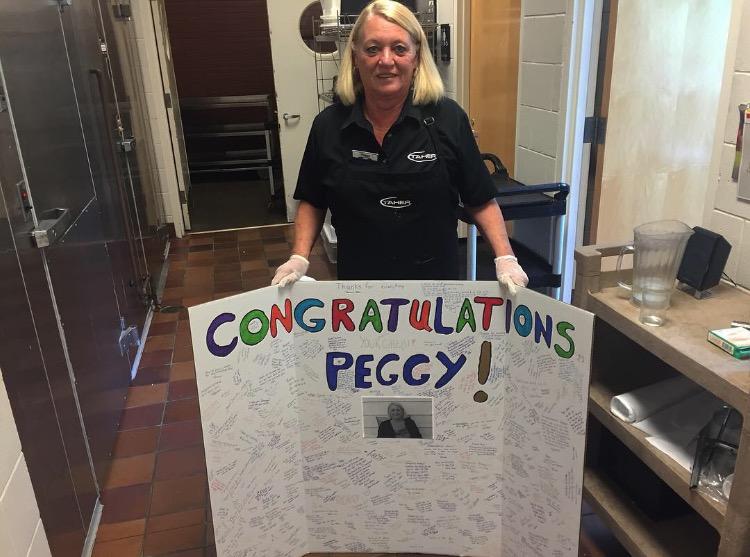 Students and Faculty signed a poster to commemorate Peggy Holzems 29 years working in the lunchroom. It was hanging up when I can in [Monday] morning, it made me want to cry, Holzem said.