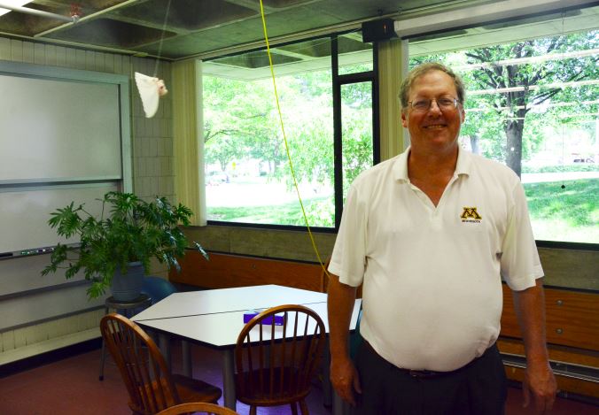 US Physics teacher Jim Tisel stands in the physics room next to the "flying pig." He said, "I'll miss the enthusiasm of the students and the wonderful connections with teaching colleagues."