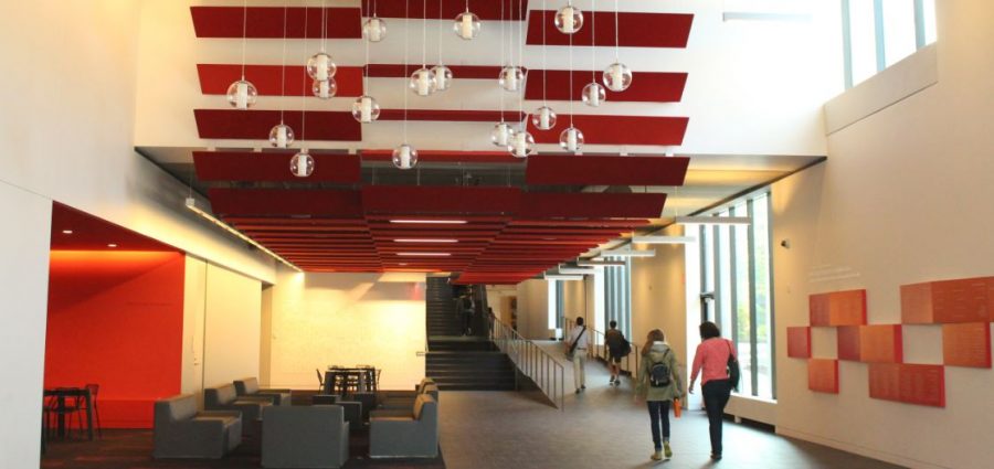 Faculty and students walk through the RedLeaf Commons in the Huss Center for Performing Arts.