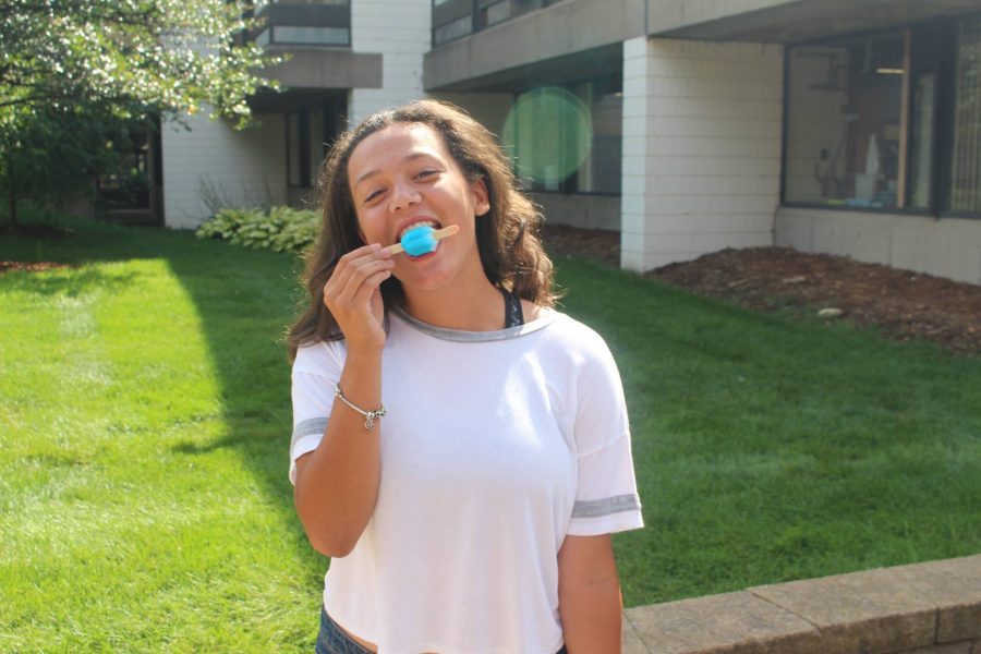 Senior Magdalena Gallagher enjoys at bomb pop at the end of the first school day.  For more photos, go to The Rubicon on Facebook.