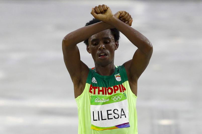 Olympic silver medalist, Ethiopian Feyisa Lilesa crossed the finish line with his arms above his head in the shape of an X. He was protesting his governments persecution of the Oromo people.