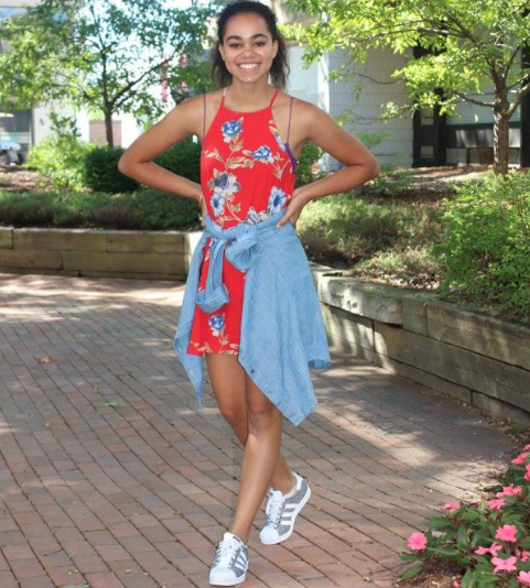Senior Meley Akpa sports her summery outfit while the sunny weather still permits it.
