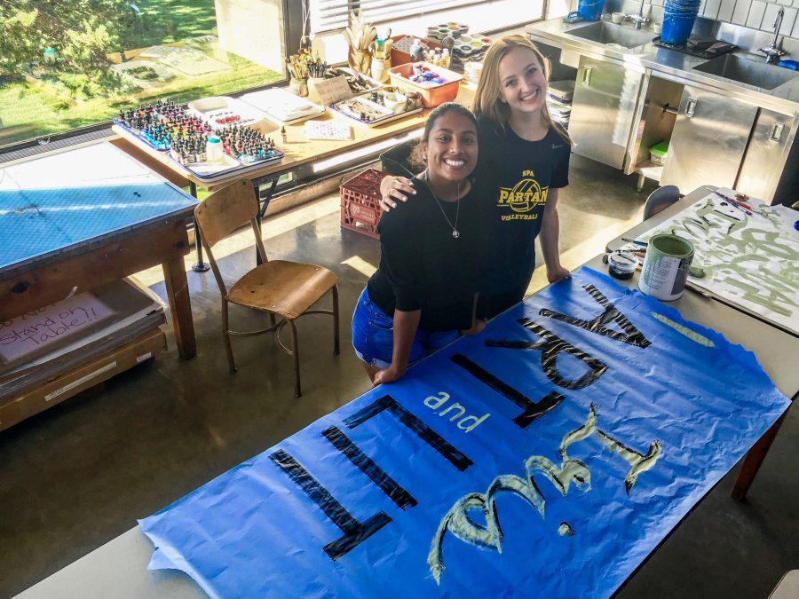Co-presidents Amodhya Samarakoon (front) and A.M. Roberts (back) work on a poster for the Clubs Fair held on Sept. 15. "[We hope to] get a good group of people who all already love art and enjoy it or want to improve and learn more," Roberts said.