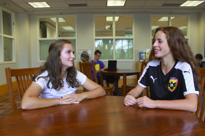 Mentor Libby Woodson gives advise to her  mentee  freshman Clark Waltz