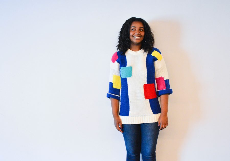 Junior Amina Smaller models a bright, geometrically printed sweater. The sweaters from this online site called Romwe, Smaller said. Romwe is an international fashion retailer based out of China that sells inexpensive, on-trend clothing. 