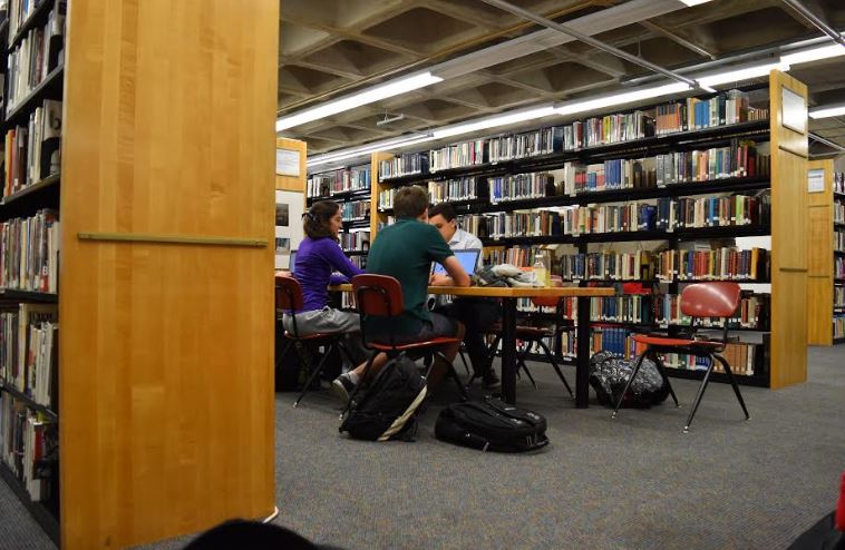 NOT ENOUGH SPACE. The library spaces at St. Paul Academy and Summit School lack the space necessary to be productive. "The tables are way too small for productive work," junior Erik Quillopa said.
