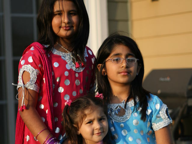 Senior Tabeer Naqvi, and her sisters Mashal and Waffa, pose in their salwar kameez, a traditional Pakistani outfit.