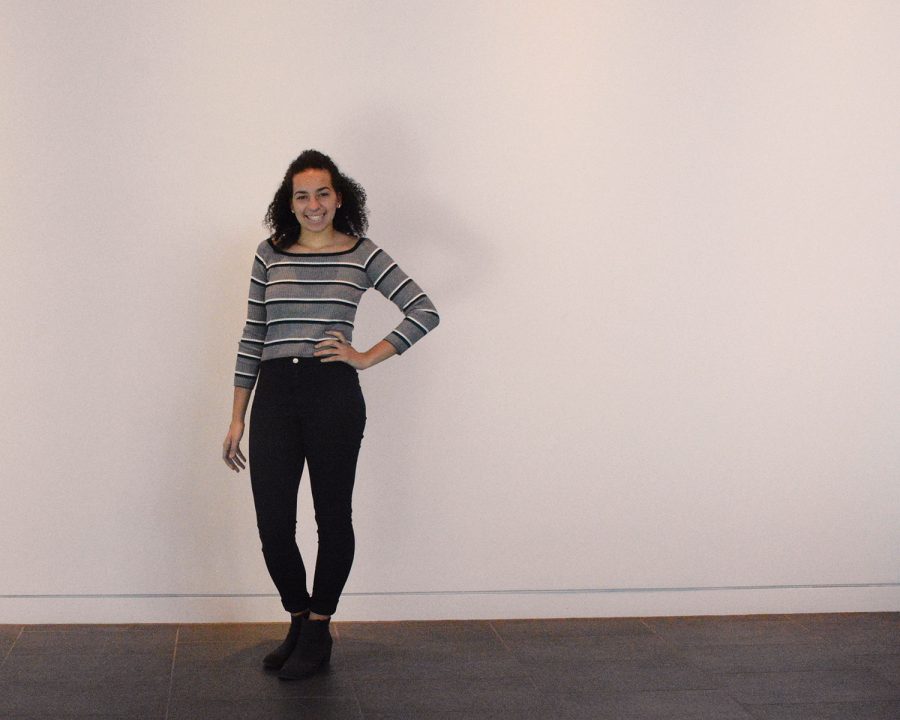 Junior Isabelle Denny keeps it simple with a neutral striped long-sleeved tee and black jeans. 