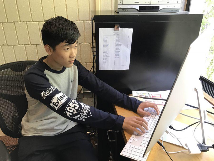UNLEASH CREATIVITY. Ninth grader Allan Wang is part of the Graphics Design class this semester. He works on Ibid, the student yearbook, with other students. “We are just all together taking pictures and [doing community building activities] like making a model,” he said.
