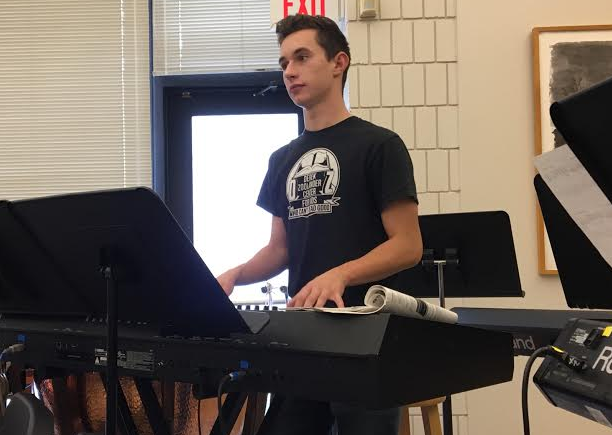 Zelle practices in the US orchestra room.  “Music has taught me a lot about perseverance. Practice sucks sometimes, but if you do it you get better, Zelle said.