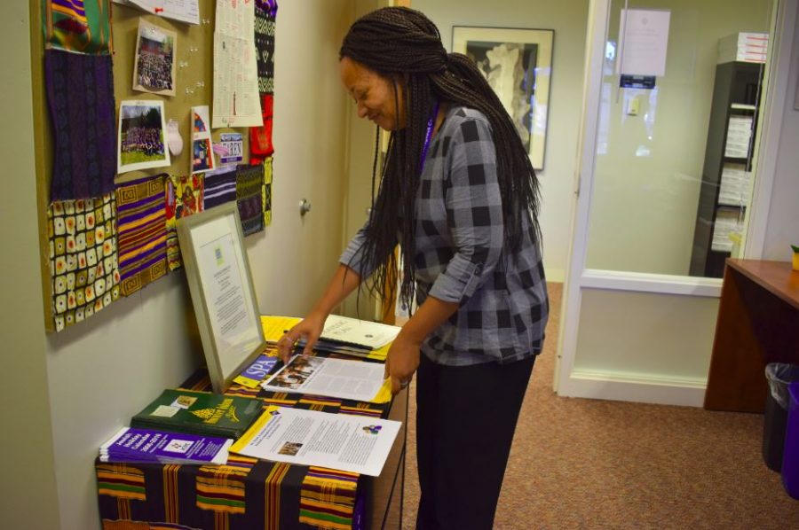 Upper School Diversity Dean Karen Dye looks over the August Diversity Forum Series training handouts in her office. The upcoming February training aims to give faculty and staff “more specific tools and strategies about having conversations with students,” Dye said. 