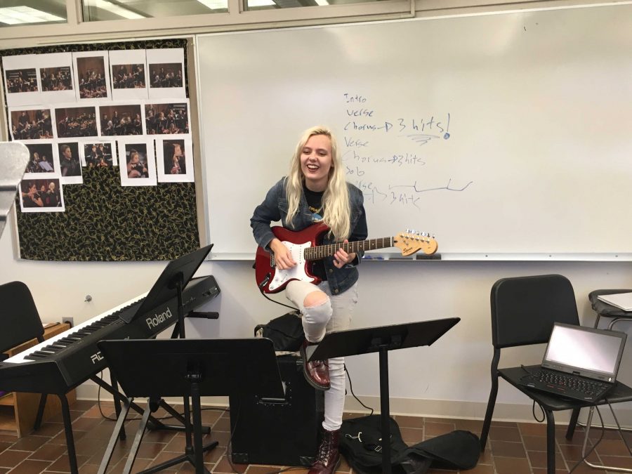 PRACTICE MAKES PERFECT. Senior Emily Schoonover held daily practices in the winds room with other members of the band to rehearse the songs that would be added. I arranged the pieces and I wrote out sheet music for everyone. Id say I worked about five hours a day on it, Schoonover said.