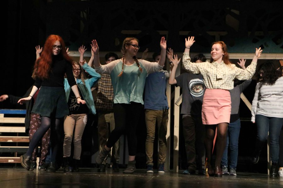 Junior Lillian Pettigrew, 9th grader Quinn Christensen, and sophomore Chloe Morse lead a dance number during tech week of the US Fall Play, As You Like It.