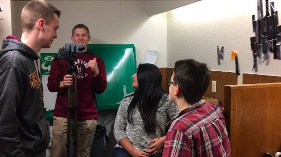 Senior Tommy Dicke works as cameraman for his production group, including seniors Tabeer Naqvi, Ian Scott, junior Ned Laird-Raylor, and 9th grader Peter Michel (seen in the video).