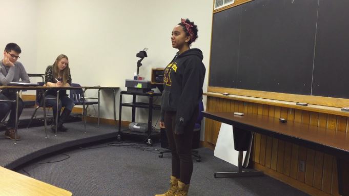 Junior Noa Carlson recites "The Nail" by C.K. Williams at the Dec. 6 Poetry Out Loud competition. "I guess Poetry Out Loud was a way to figure out if I actually liked poetry - and I guess I do," Carlson said. 