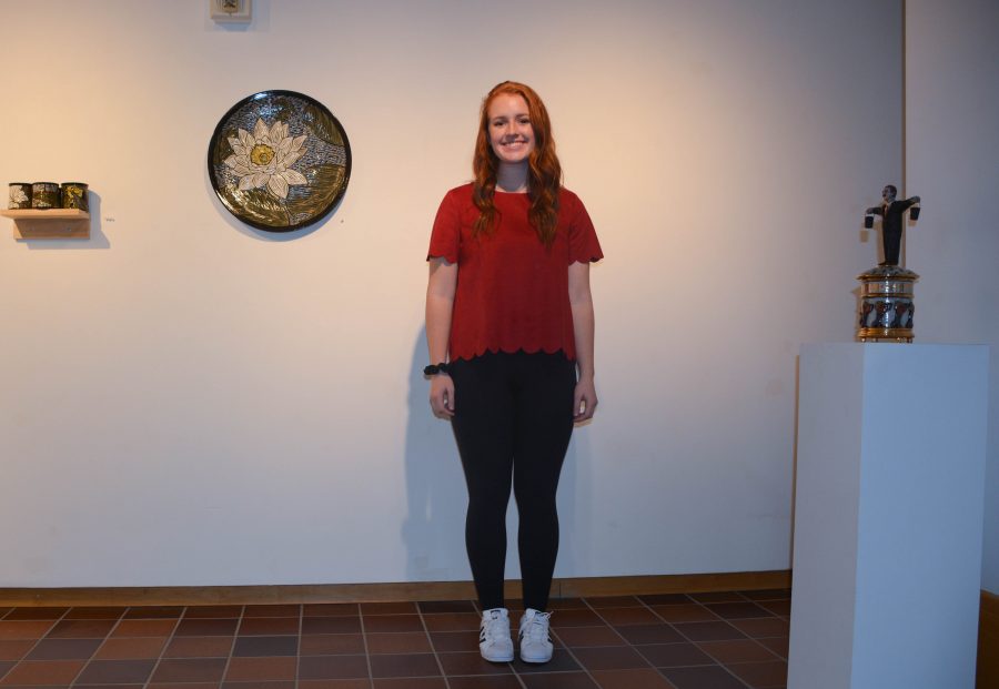 Senior Macy Blanchard combines textures and patterns with a red, suede, scalloped shirt.  I got this shirt from Francescas, Blanchard said. 