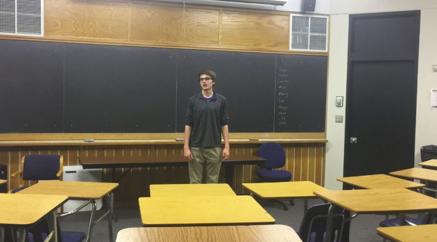 Senior Peter Schavee recites a poem on Dec. 8.