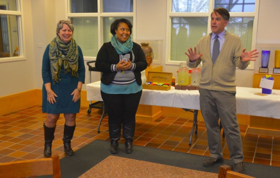 Upper School Principal Chris Hughes and then College Counseling Assistant Aja Parham celebrate 17 years of service from former Upper School Assistant Annie Harness.