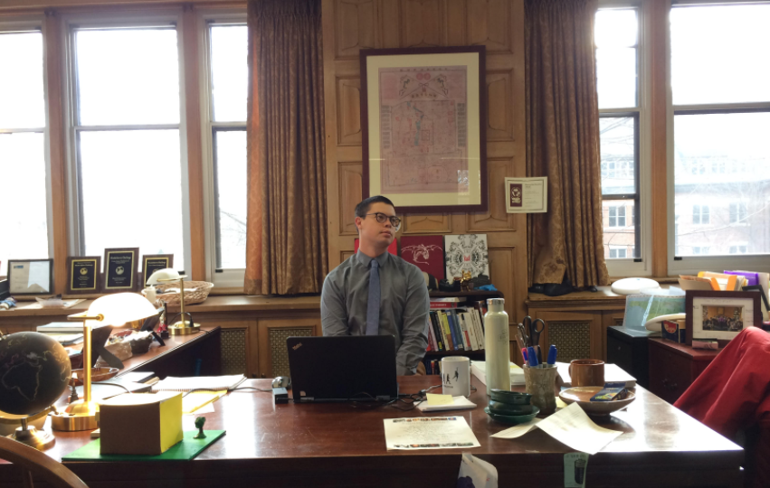 History teacher Ryan Oto poses in the history office in preparation for the new History of Race class debuting in the spring of 2017.