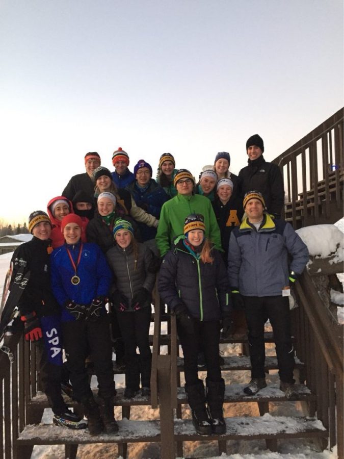 The Varsity Nordic ski team bundles up after the rescheduled Mesabi Meet. “To make sure I don’t freeze I wear lots of warm layers, a buff, and a hat, and hand and toe warmers are a necessity,” junior Nordic skier Dina Moradian said.