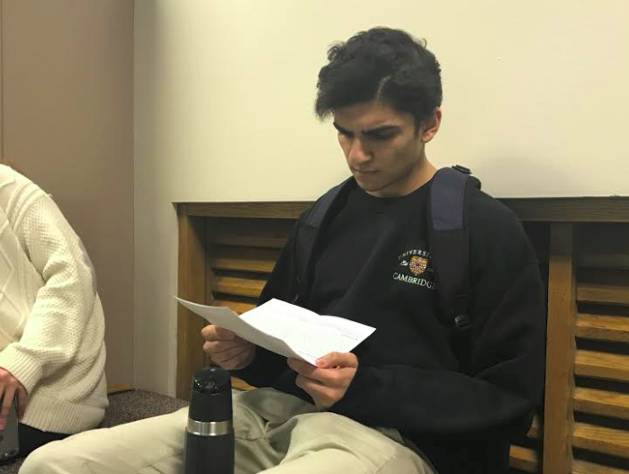 Senior Muneil Rizvi reads the narrative comments that he recieved from his teachers following the first semester. "They are helpful for the students mostly because they help to improve organization and other things the teachers feel are important for the student," Rizvi said.