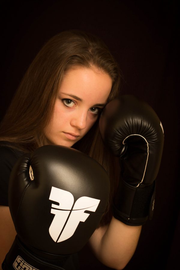9th grader Megan Massie boxes in her free time. “People ask me if I beat other girls. I’m still feminine. I'm aggressive in the sport but not outside.” Massie said.