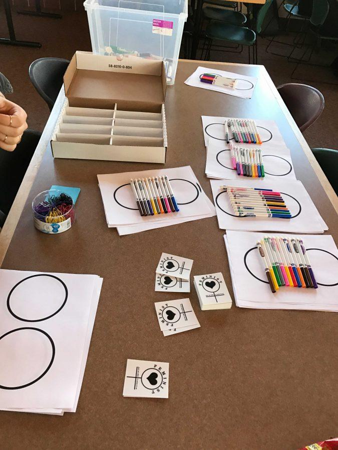 The supplies table waits for students to get markers and paper.