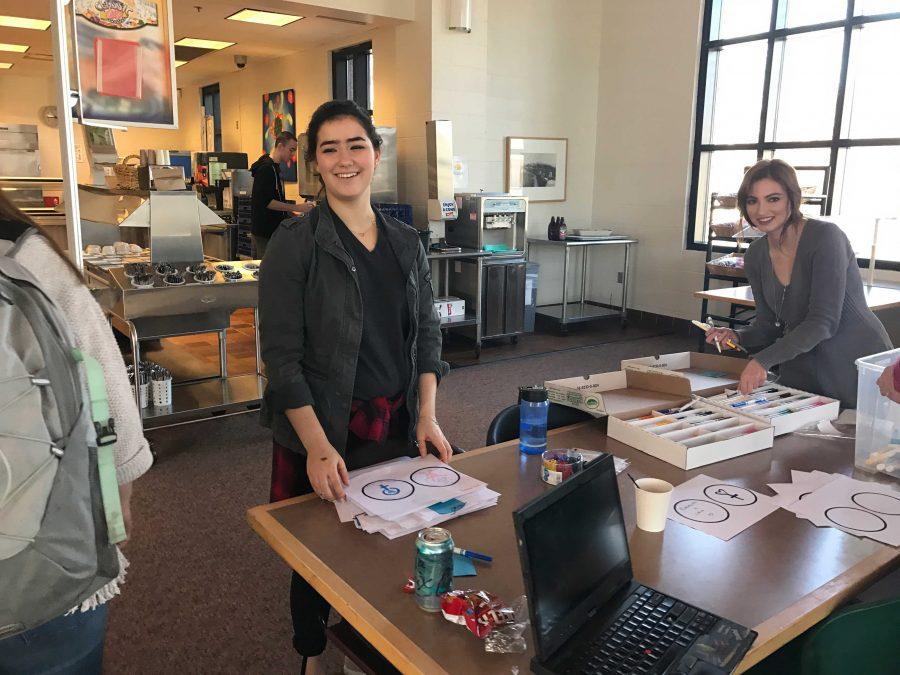 HerSpace co-president, junior Numi Katz,jokes with people as they get supplies. Its nice that SPA is having an event advisories can participate in, said sophomore William Rinkoff.
