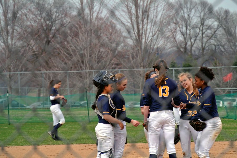 The team talks before they start another inning.